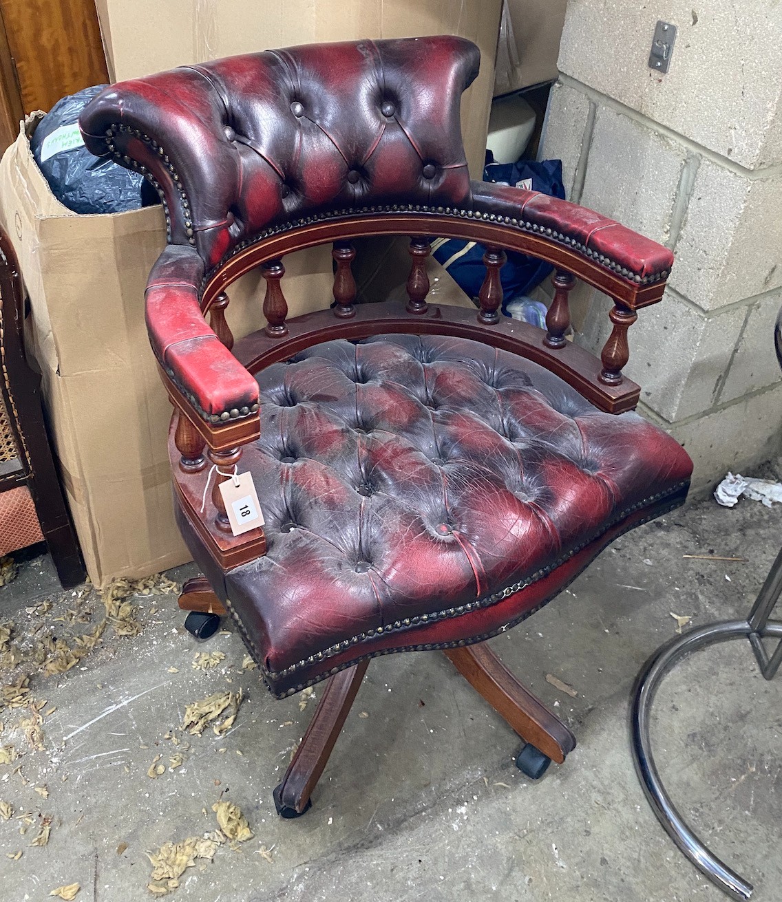 A reproduction buttoned burgundy leather swivel desk chair, width 60cm, depth 54cm, height 84cm